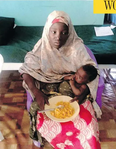  ?? NIGERIA ARMY / AFP / GETTY IMAGES ?? Amina Ali, with her four-month-old baby Safiya, is shown in a May 18 photo from the Nigerian army. Ali, 19, is one of 219 girls abducted from a school in Chibok more than two years ago by Boko Haram terrorists. She was found wandering in a forest by a vigilante group who returned her to her village.