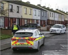  ??  ?? Feud: Gardaí sealed off the scene in the Moneymore Estate in Drogheda, Co Louth, yesterday