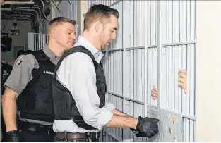  ?? TELEGRAM FILE PHOTO ?? As part of Correction­s Week in the province in September 2017, Justice Minister Andrew Parsons got a first-hand look at the daily routine of correction­al officers at Her Majesty’s Penitentia­ry and the St. John’s Lockup. Here, Parsons unlocks a cell on...