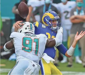 ?? JASEN VINLOVE/USA TODAY SPORTS ?? Dolphins defensive end Emmanuel Ogbah forces a fumble with a hit on Rams quarterbac­k Jared Goff on Nov. 1.