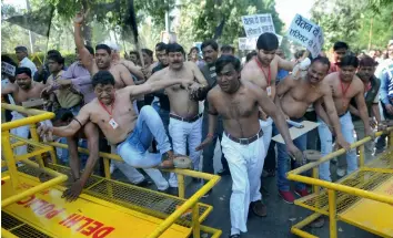  ?? — BIPLAB BANERJEE ?? Municipal Corporatio­n of Delhi workers take part in a protest against chief minister Arvind Kejriwal in New Delhi on Thursday, demanding the release of their salaries.