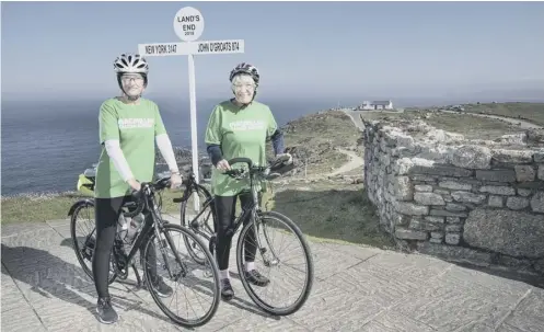  ??  ?? 0 81-year-old Mavis Paterson, right, prepares to set off from Land’s End yesterday, accompanie­d by supporter Heather Curley