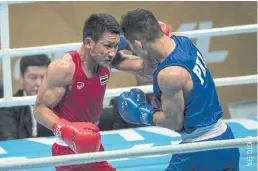  ??  ?? Chatchai Butdee, left, on his way to winning gold at the 2017 SEA Games.