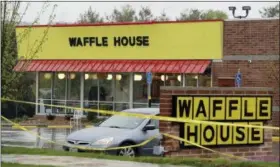  ?? THE ASSOCIATED PRESS ?? Police tape blocks off a Waffle House restaurant Sunday in Nashville, Tenn. At least four people died after a gunman opened fire at the restaurant early Sunday.