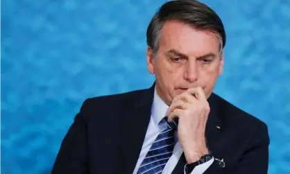  ??  ?? President Jair Bolsonaro appeared in a photo in March with the alleged getaway car driver and now with the man who allegedly disposed of the guns used to kill Marielle Franco. Photograph: Adriano Machado/Reuters