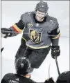  ?? Erik Verduzco ?? Review-journal @Erik_verduzco Golden Knights defenseman Colin Miller receives the traditiona­l glove tap from teammates on the bench after his goal on Tuesday against Columbus forged a 2-2 tie in the second period.