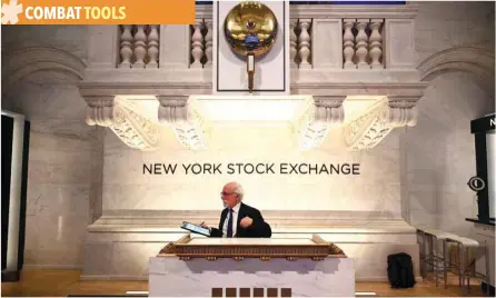  ?? — Reuters ?? A trader works during the opening bell at the New York Stock Exchange (NYSE) at Wall Street in New York City.