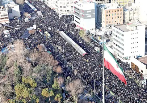  ?? — AFP photo ?? A handout picture provided by the office of Iran’s Supreme Leader Ayatollah Ali Khamenei shows mourners gather to pay homage to Soleimani, after he was killed in a US strike in Baghdad, in the capital Tehran.