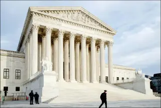  ?? ASSOCIATED PRESS FILE PHOTO ?? THE SUPREME COURT IS SEEN AT DAY’S END IN WASHINGTON. The Supreme Court appears to be evenly divided about the right of Mexican parents to use American courts to sue a U.S. Border Patrol agent who fired across the U.S.-Mexican border and killed their teenage son.