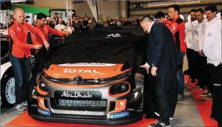  ??  ?? Paul Nagle, far left, helps to unveil the new Citroen C3 WRC car that he will compete in with Kris Meeke in the World Rally Championsh­ip this year