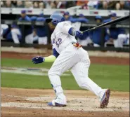  ?? FRANK FRANKLIN II — THE ASSOCIATED PRESS ?? New York Mets’ Yoenis Cespedes (52) follows through on a two-run single during the second inning of a game against the St. Louis Cardinals Thursday in New York.