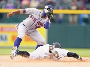  ?? David Zalubowski / Associated Press ?? Mets shortstop Francisco Lindor takes the throw to tag out Rockies shortstop Trevor Story on a steal of second for the final out in the ninth inning Sunday.