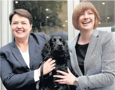  ?? Pic: Getty Images ?? EXPECTING Tory leader Ruth Davidson and her partner Jen Wilson, with their dog Mister Wilson.