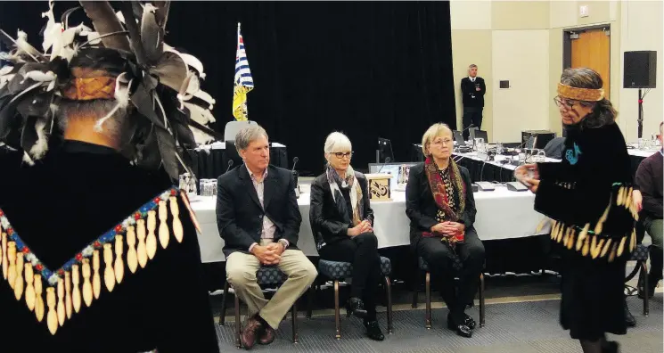  ?? DOUGLAS QUAN ?? Members of the Snuneymuxw First Nation perform a salmon ceremony for members of the National Energy Board panel during hearings on the Trans Mountain pipeline expansion on Wednesday in Nanaimo. The panel’s task was to gather oral evidence from the leaders about possible harmful effects of marine traffic related to the expansion.