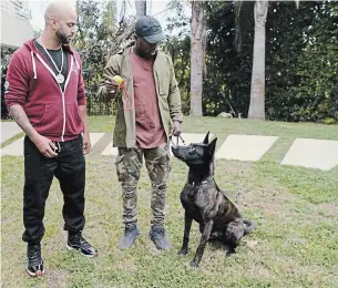  ?? NETFLIX ?? Jas Leverette, left, with client Andre Berto in Netflix’s new show “Canine Interventi­on.”