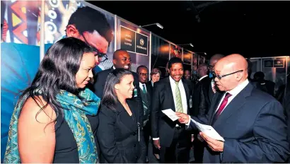  ?? Picture: GCIS ?? CALLED BY NAME. President Jacob Zuma hands over Smart ID cards to some young people during the unveiling of e-Home Affairs at Gallagher Convention Centre in Midrand.