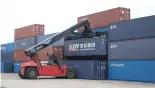  ?? ?? A staff member loads a cargo container of China Railway Express to a train in Malaszewic­ze, Poland, Oct. 15, 2021. (Xinhua/Zhou Nan)