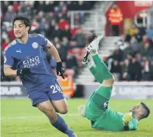  ??  ?? Shinji Okazaki celebrates scoring Leicester’s fourth goal against Saints.