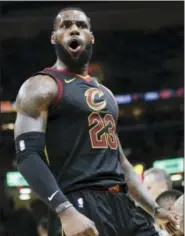  ?? TONY DEJAK — ASSOCIATED PRESS ?? Cavaliers’ LeBron James reacts after dunking against the Toronto Raptors during the third game of Cleveland’s second-round playoff series in Cleveland last Saturday.