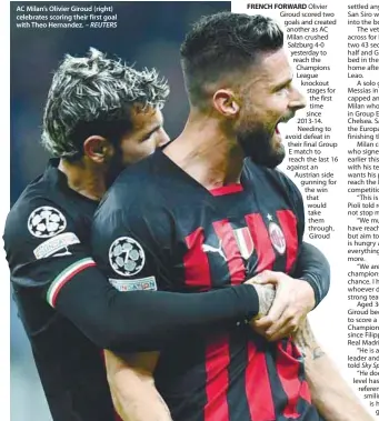  ?? – REUTERS ?? AC Milan’s Olivier Giroud (right) celebrates scoring their first goal with Theo Hernandez.