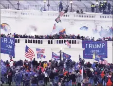  ?? Associated Press ?? Rioters on the West Front at the U.S. Capitol on Jan. 6, 2021, in Washington, D.C.