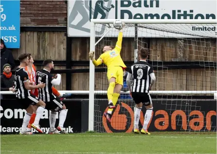  ?? PICTURES: Simon Howe ?? Bath City goalkeeper Ryan Clarke gets a hand to a shot during the goalless draw against Braintree Town