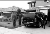  ?? ALEX GALLARDO/AP ?? A detective walks next to a home where police arrested the Turpins in Perris, 60 miles southeast of Los Angeles.