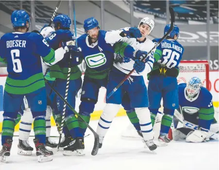  ?? JASON PAYNE ?? Brock Boeser led the way with a goal and two assists Saturday as the Canucks rallied to defeat the NHL-leading Leafs at Rogers Arena.