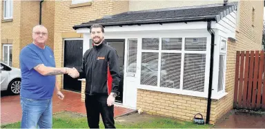  ??  ?? New porch Jason Lisset of Caledonian Windows admires customer Les Hughes’ porch of his Stewarton home