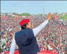  ?? PTI ?? Samajwadi Party president Akhilesh Yadav waves at the crowd during 'Samajwadi Vijay Yatra' in Jhansi on Friday.