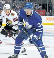  ?? CLAUS ANDERSEN/GETTY IMAGES ?? Chicago Blackhawks’ winger Patrick Kane skates against Auston Matthews, of the Toronto Maple Leafs, during a game at the Air Canada Centre on Monday, in Toronto. The Leafs won the game 4-3, with Matthews scoring the overtime winner.