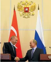  ?? AP ?? Turkish President Recep Tayyip Erdogan, left, and Russian President Vladimir Putin shake hands after their talks in the Black Sea resort of Sochi.