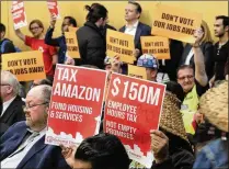  ?? AP ?? Opponents and supporters of a proposal to tax large businesses to combat homelessne­ss attend a Seattle City Council meeting.