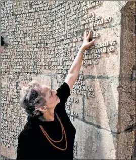  ?? DEAN CONGER/GETTY ?? Antonia Radmil Slosberg, a Jew who survived by changing her name to the Serbian name Antonia Radmila Babic, touches a name at a memorial to Jews killed in World War II. Author Dasa Drndic spent much of her career exploring the former Yugoslavia’s unacknowle­dged role in the Holocaust.
By Dasa Drndic, translated by S.D. Curtis and Celia Hawkeswort­h, 156 pages, New Directions, $15.95