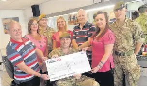  ?? ALISTAIR WILSON.
AN144347 ?? His Hair staff Claire Bell, Kim Woodman and Jenna Barrett are joined by Help for Heroes representa­tivess Ray Wood (left) and Mike Betts, and soldiers CSgt Downie (centre), Gdsm Doyle (right) and Gdsm Boyd after the barber collected £345 to help the...