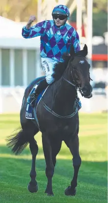  ?? Picture: Getty Images ?? Jockey Declan Bates celebrates Pride Of Jenni’s superb win in the $5m Queen Elizabeth Stakes at Randwick.