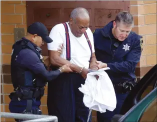  ?? AP PHOTO JACQUELINE LARMA ?? Bill Cosby is escorted out of the Montgomery County Correction­al Facility, Tuesday Eagleville, Pa., following his receiving a three-to-10-year prison sentence for sexual assault.