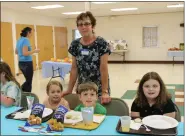  ?? SUBMITTED PHOTO — SUSAN LEIBY, FIRST REFORMED CHURCH ?? Snack time with Hazel and Sully Phillips, and Hannah Hamm with Peggy Seitzinger, standing.