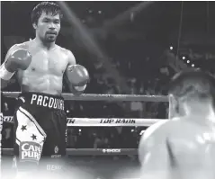 ??  ?? Manny Pacquiao knocks down Jessie Vargas during the second round of their fight on Saturday