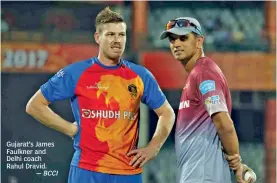  ?? — BCCI ?? Gujarat’s James Faulkner and Delhi coach Rahul Dravid.