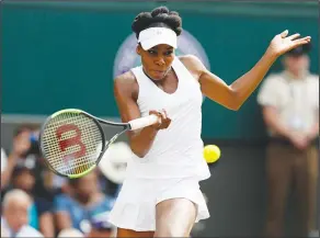  ?? Associated Press ?? On to the final: Venus Williams returns to Johanna Konta during their women's singles semifinal match at the Wimbledon tennis championsh­ips in London on Thursday.