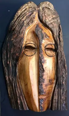  ??  ?? “John Lennon” Wood Sculpture