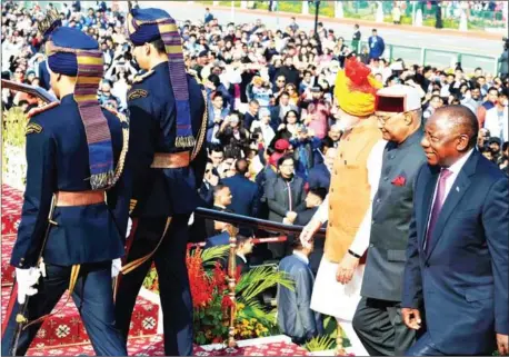  ?? INDIAN PRESIDENTI­AL PALACE ?? This handout photograph released and taken by the Indian Presidenti­al Palace on January 26 shows Indian Prime Minister Narendra Modi (third right), President Ram Nath Kovind (second right) and President of South Africa Matamela Cyril Ramaphosa (right) arriving ahead of the 70th Republic Day parade in New Delhi.