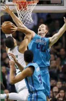  ?? MICHAEL DWYER — THE ASSOCIATED PRESS ?? Charlotte’s Cody Zeller (40) blocks a shot by Boston’s Jayson Tatum (0) during the fourth quarter in Boston on Friday.