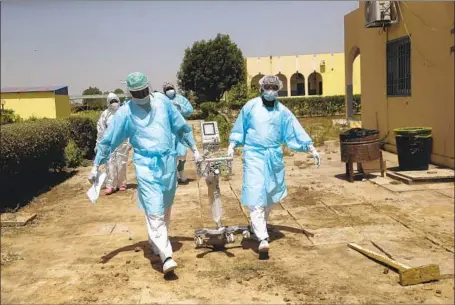  ?? Photograph­s by Sunday Alamba Associated Press ?? THE FARCHA provincial hospital in N’Djamena, Chad’s capital, is a brand-new campus. Doctors Without Borders has helped supply oxygen, and the hospital has 13 ventilator­s and plenty of masks and hand sanitizer. But not a single employee there has been vaccinated.