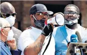  ??  ?? Terrence Floyd speaks at a makeshift memorial honouring his brother George at the spot where he was taken into custody