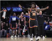  ?? JOHN MINCHILLO — THE ASSOCIATED PRESS ?? Knicks forward Julius Randle reacts as his team maintains their lead in the second half of Sunday’s game against the 76ers in New York.