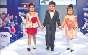  ??  ?? (Right and below left) Children model apparel at the fourth annual edition of India Kids Fashion Week, held in Delhi and Mumbai in February.