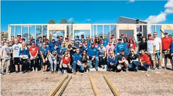  ?? COURTESY ?? Employees and alumni from the Florida Panthers and Tampa Bay Lightning help Habitat for Humanity rebuild in areas of Collier County where homes were destroyed by Hurricane Irma.