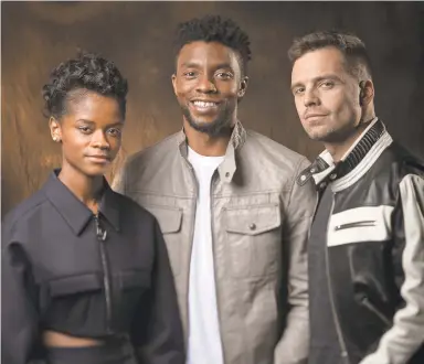  ?? DAN MACMEDAN/USA TODAY ?? Letitia Wright, Chadwick Boseman and Sebastian Stan, last seen in “Black Panther,” come together in “Avengers: Infinity War.”